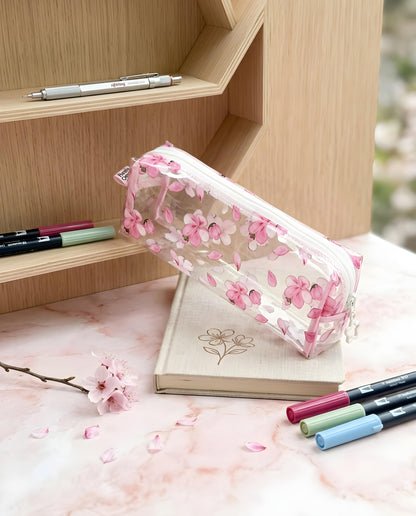 Estojo transparente sakura deitado com marcadores
